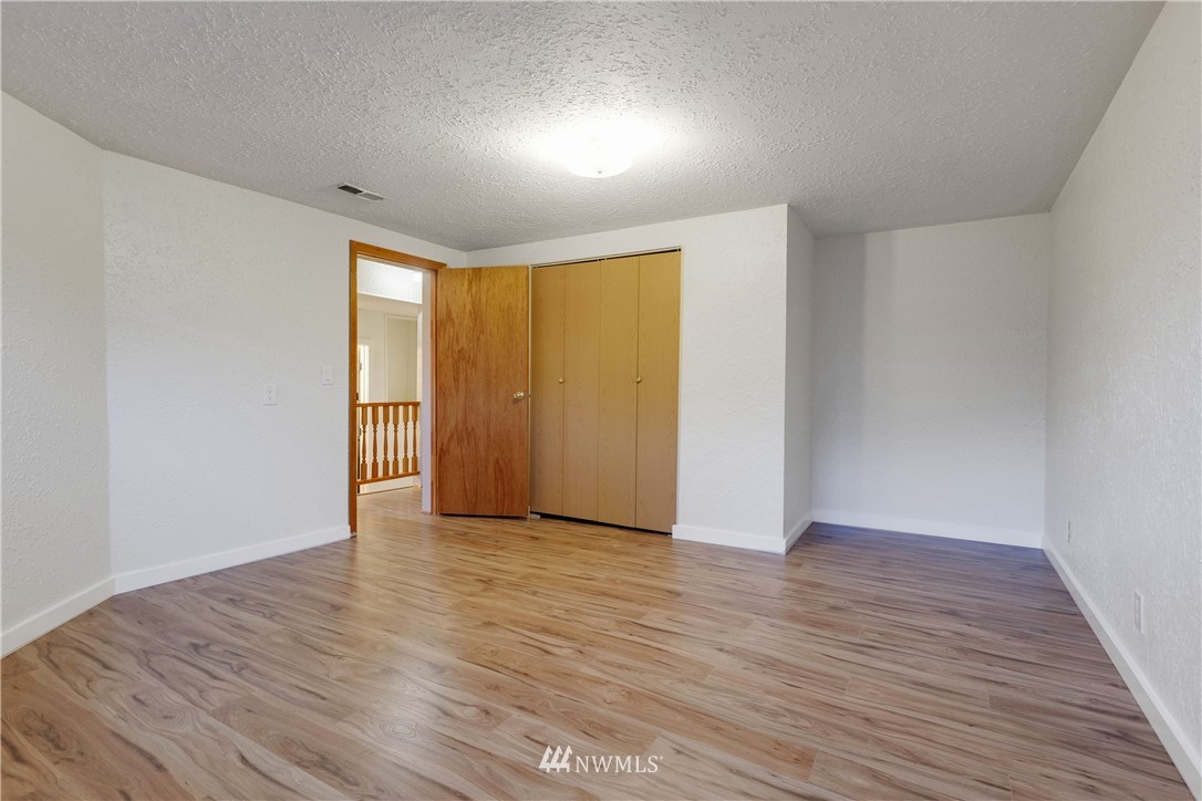 1433 South Hinds Street Seattle, WA 98144 - Photo 36 of 40 a view of an empty room with wooden floor