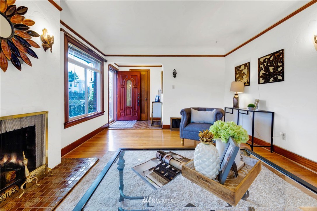 1433 South Hinds Street Seattle, WA 98144 - Photo 5 of 40 a living room with furniture and a fireplace
