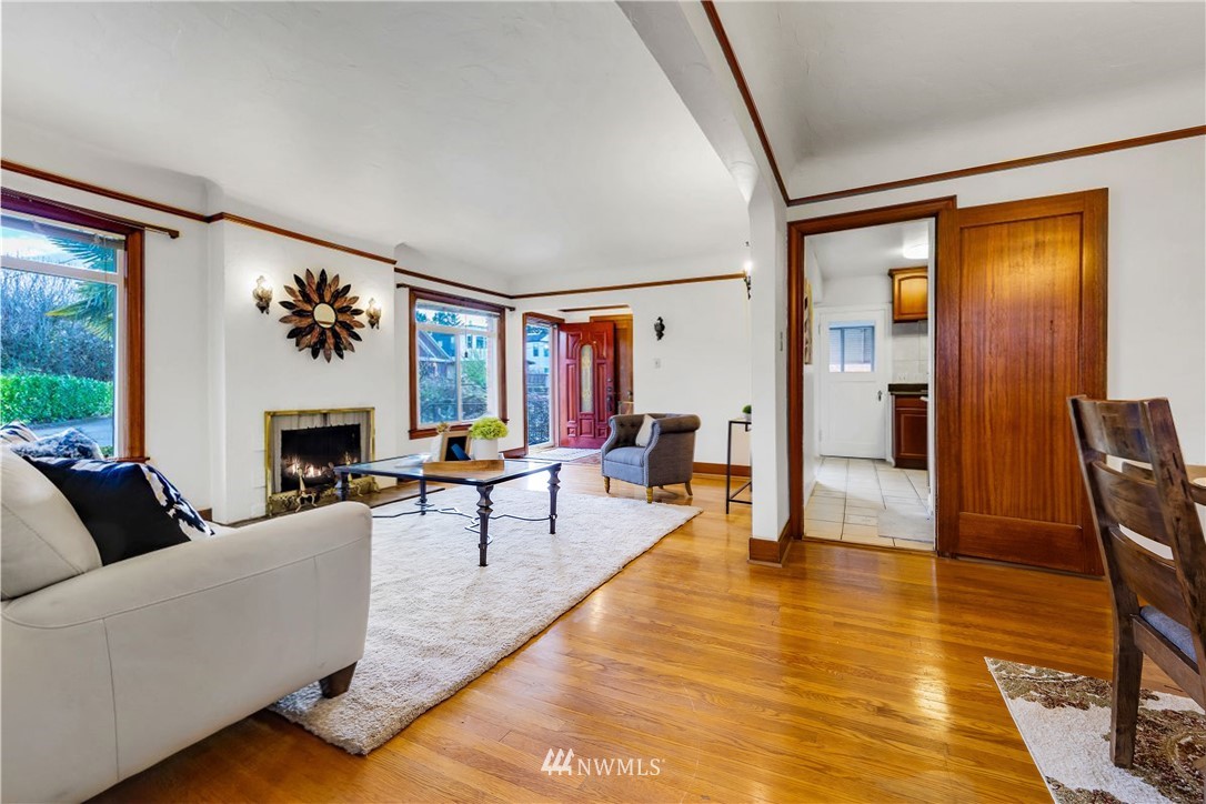 1433 South Hinds Street Seattle, WA 98144 - Photo 7 of 40 a living room with furniture two window and a fireplace