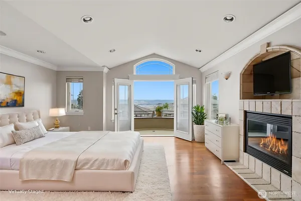 a bedroom with a bed and a television