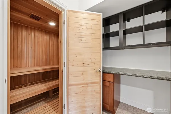 a bathroom with a shower and a mirror