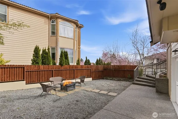 a view of a patio with a table and chairs