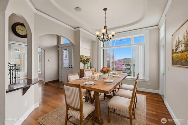 a view of a dining room with furniture window and wooden floor