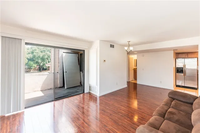 a view of livingroom with furniture and wooden floor