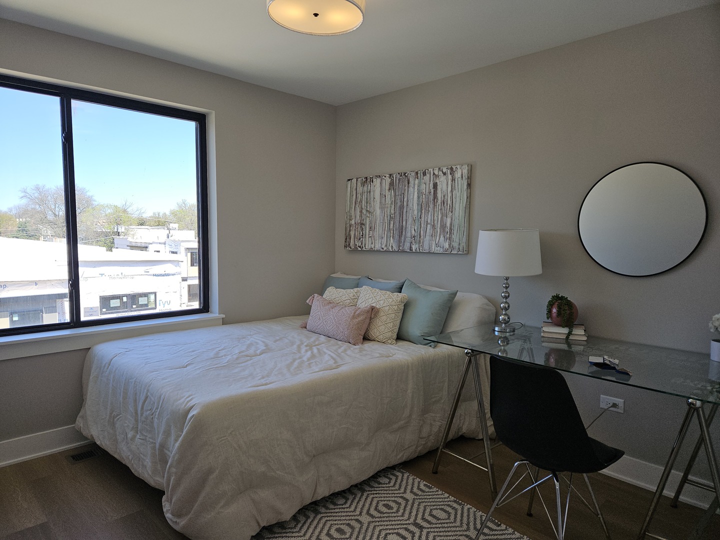 183 Pointe Drive, Unit 183 Northbrook, IL 60062 - Photo 9 of 15 a bed room with a bed window and a table