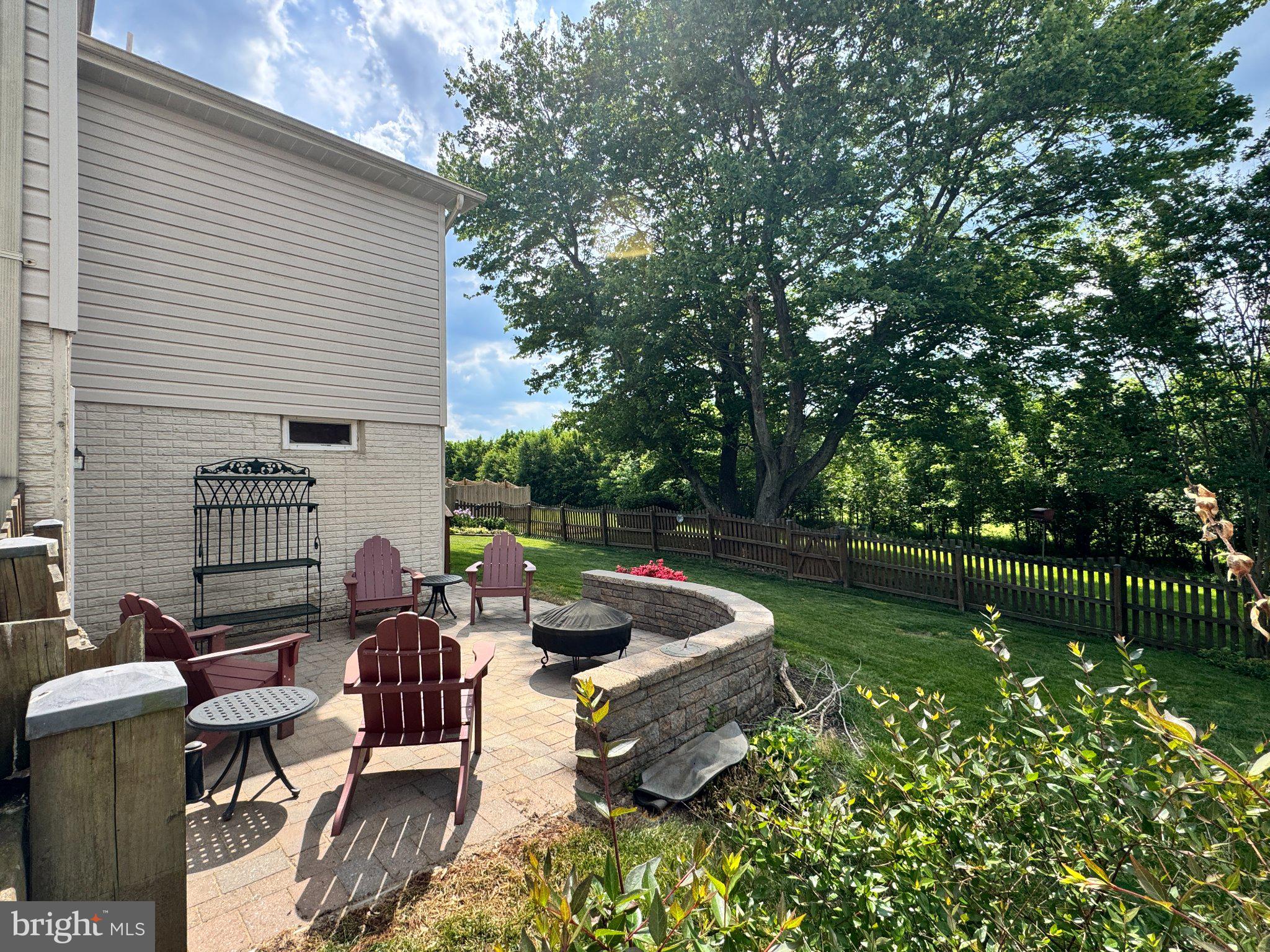 9310 Glen Vista Road Perry Hall, MD 21128 - Photo 2 of 2 a view of a backyard with sitting area and garden
