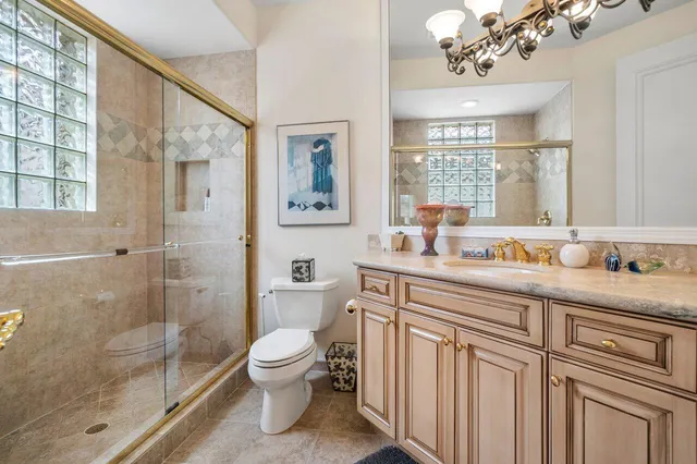 a bath room with a toilet a sink and a bath tub