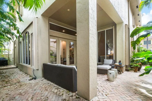 a view of a balcony with chair and tables