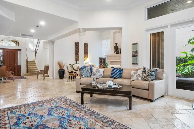 a living room with furniture and a rug