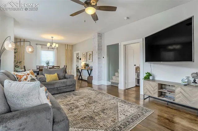 a living room with furniture and a flat screen tv
