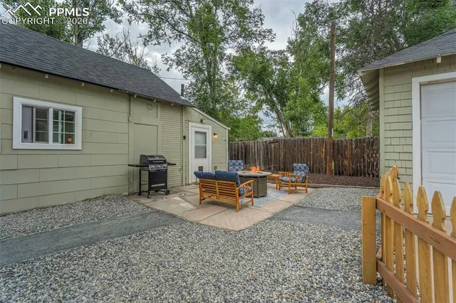 a view of a bench in the backyard