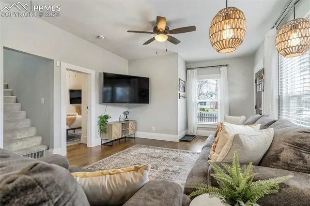 a living room with furniture and a flat screen tv
