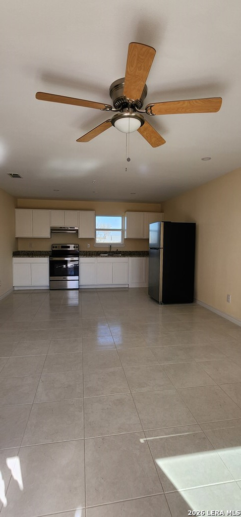 118 Grass Valley Road, Unit 208 Eagle Pass, TX 78852 - Photo 3 of 28 a living room with furniture and a ceiling fan