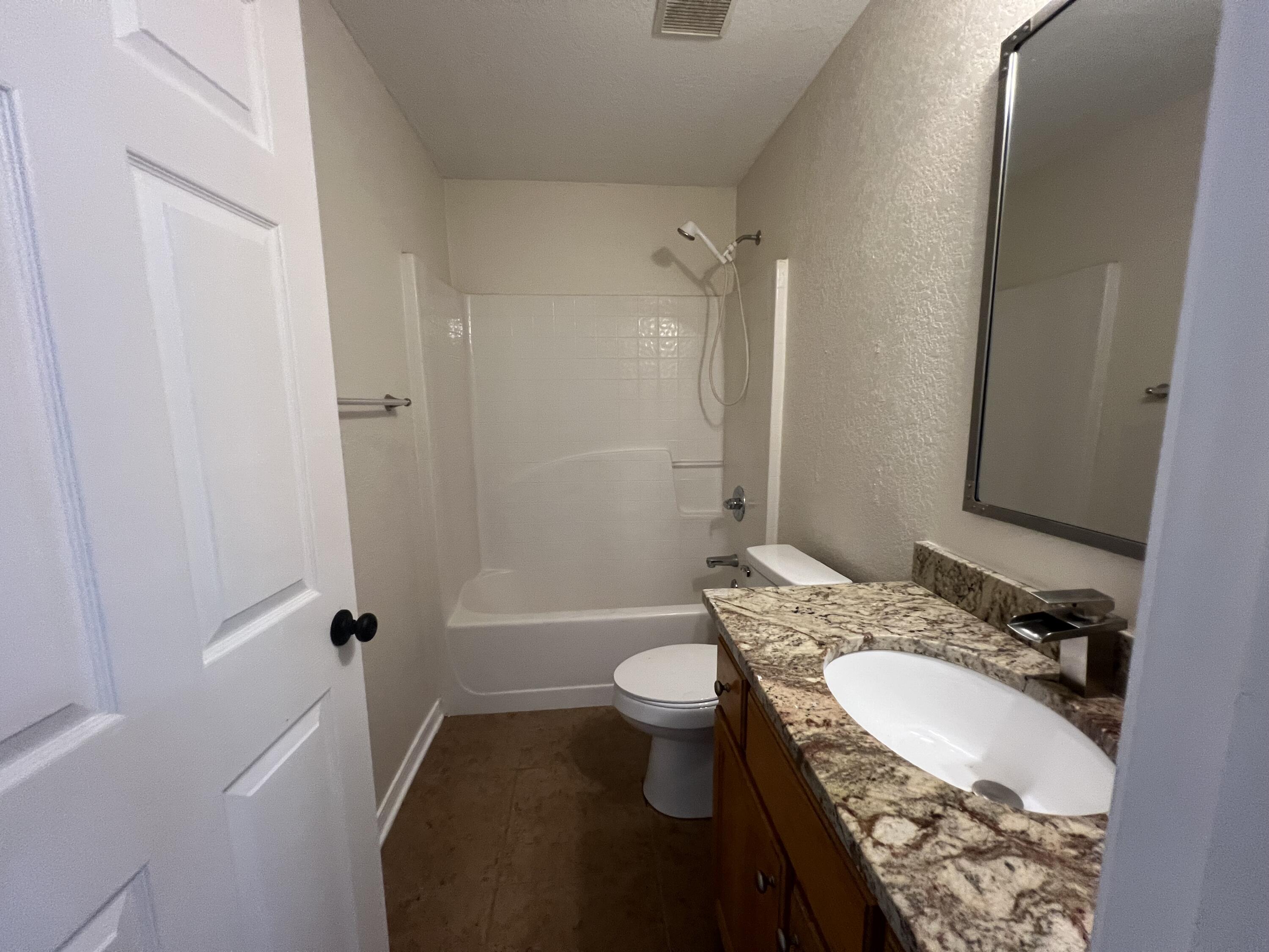 2864 Shoffner Avenue Crestview, FL 32539 - Photo 13 of 29 a bathroom with a granite countertop sink toilet and shower