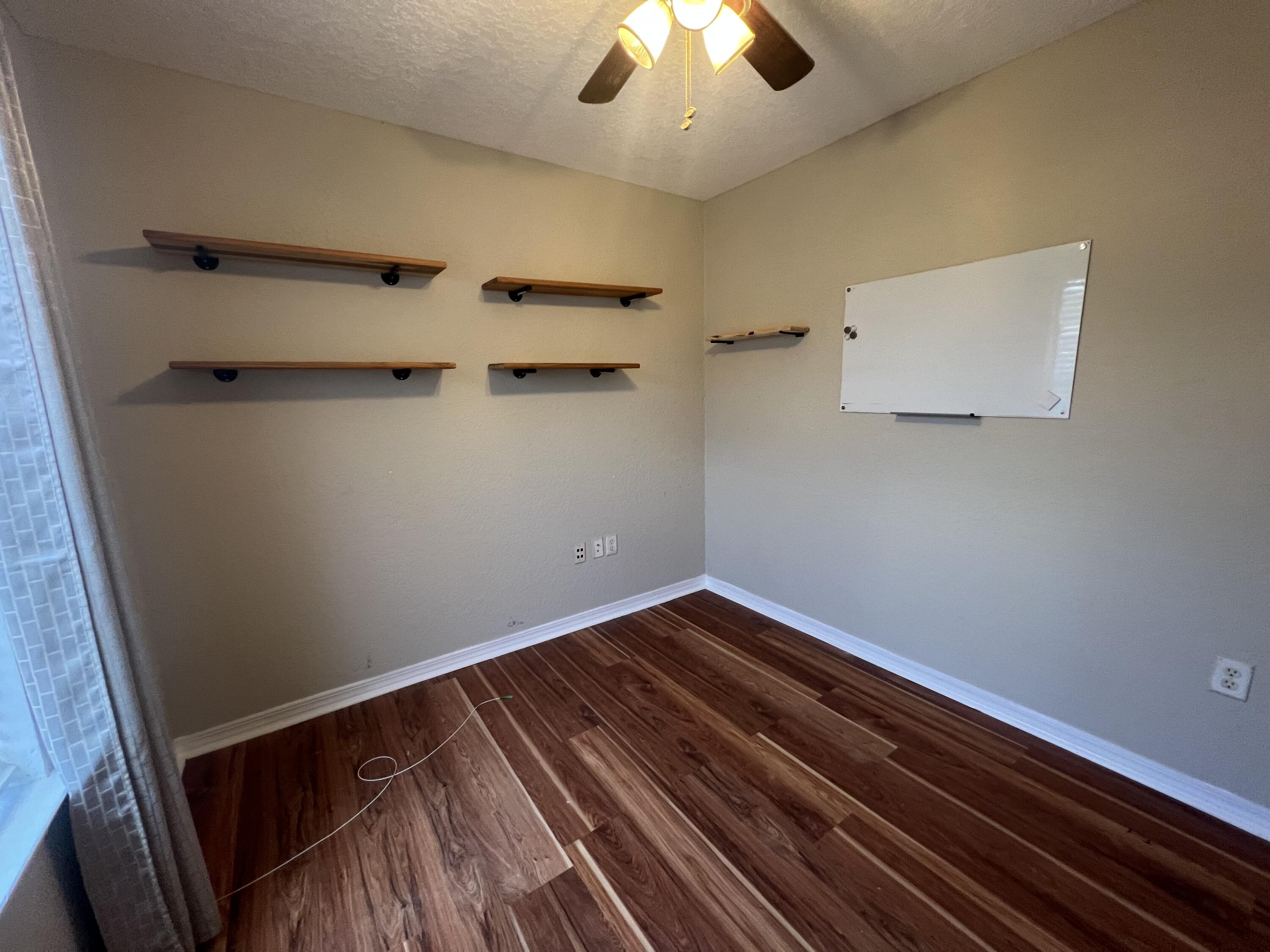 2864 Shoffner Avenue Crestview, FL 32539 - Photo 16 of 29 a view of a room with racks on the wall