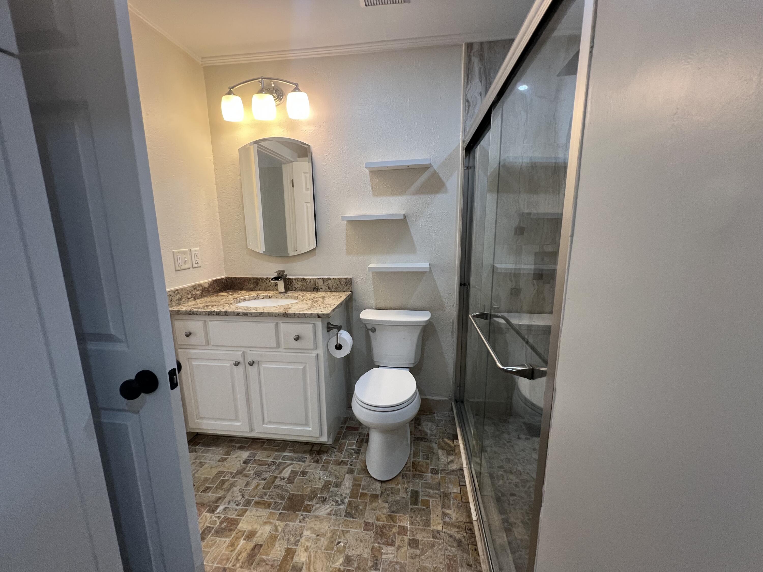 2864 Shoffner Avenue Crestview, FL 32539 - Photo 21 of 29 a bathroom with a toilet sink and mirror