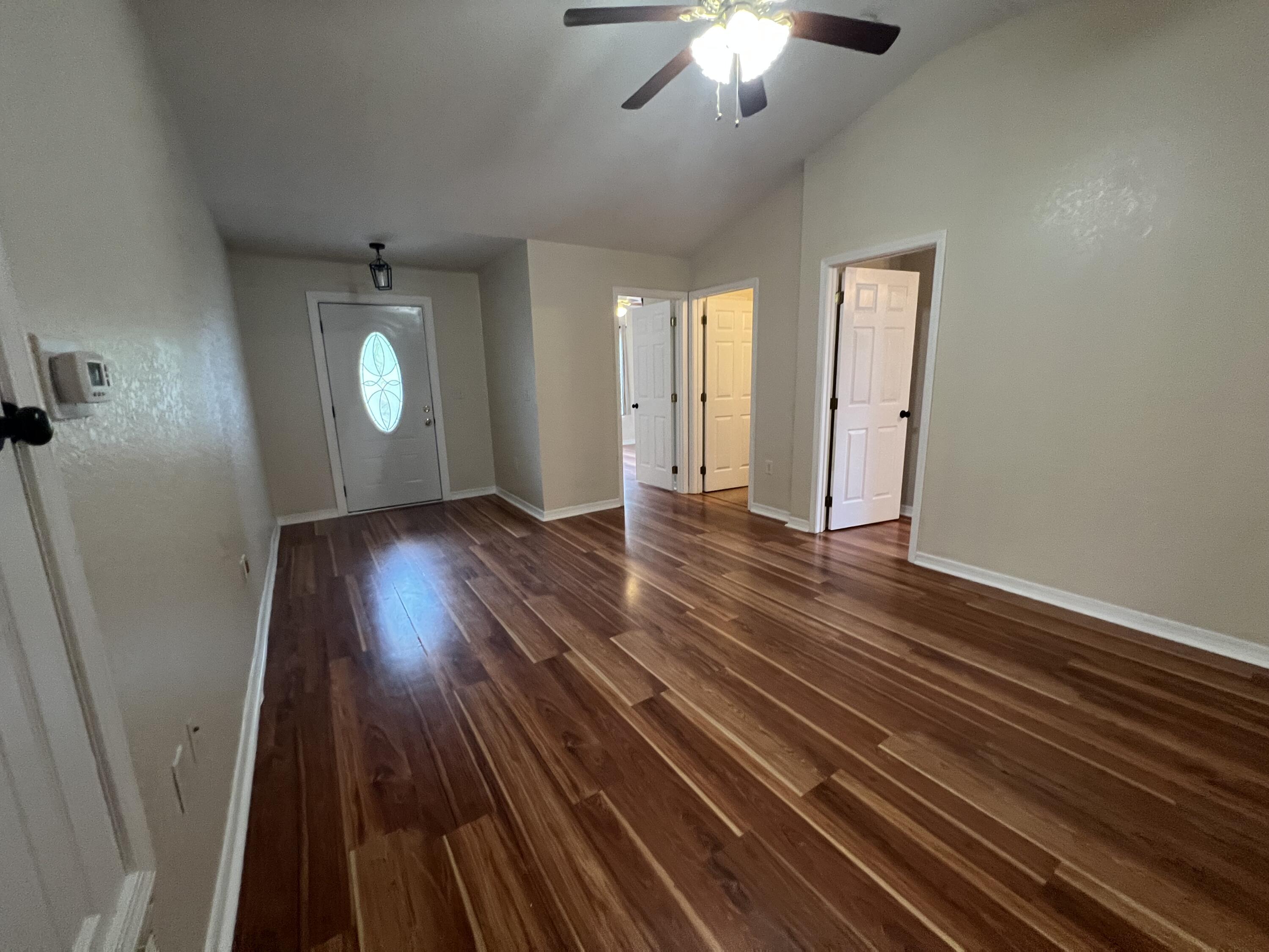 2864 Shoffner Avenue Crestview, FL 32539 - Photo 4 of 29 wooden floor in an empty room with a window
