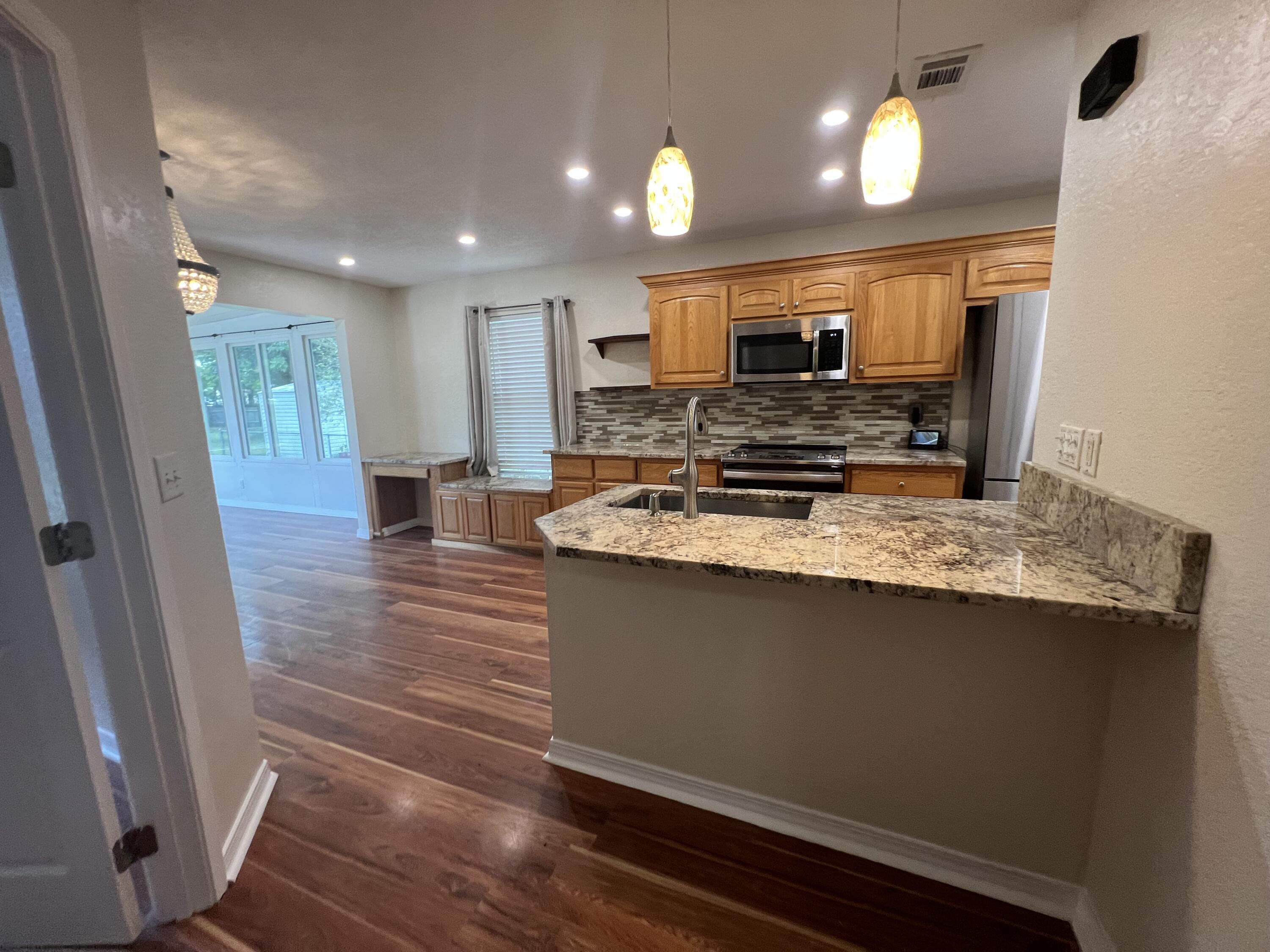 2864 Shoffner Avenue Crestview, FL 32539 - Photo 5 of 29 a view of kitchen with sink microwave and refrigerator