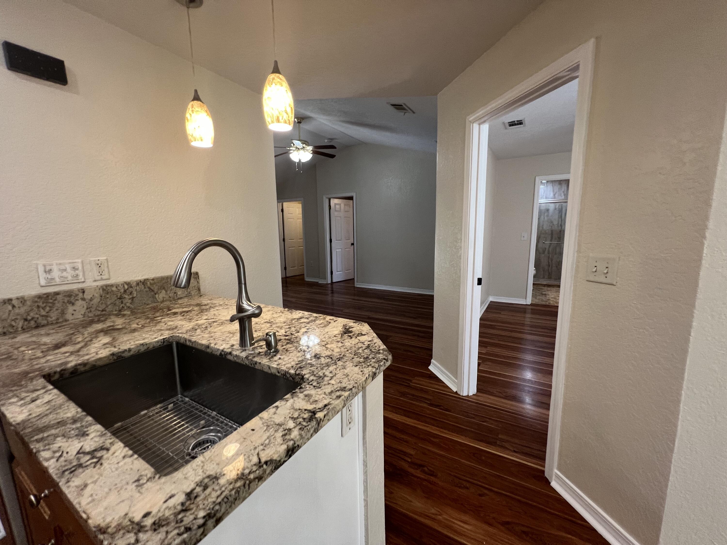 2864 Shoffner Avenue Crestview, FL 32539 - Photo 10 of 29 a kitchen with a sink and a refrigerator