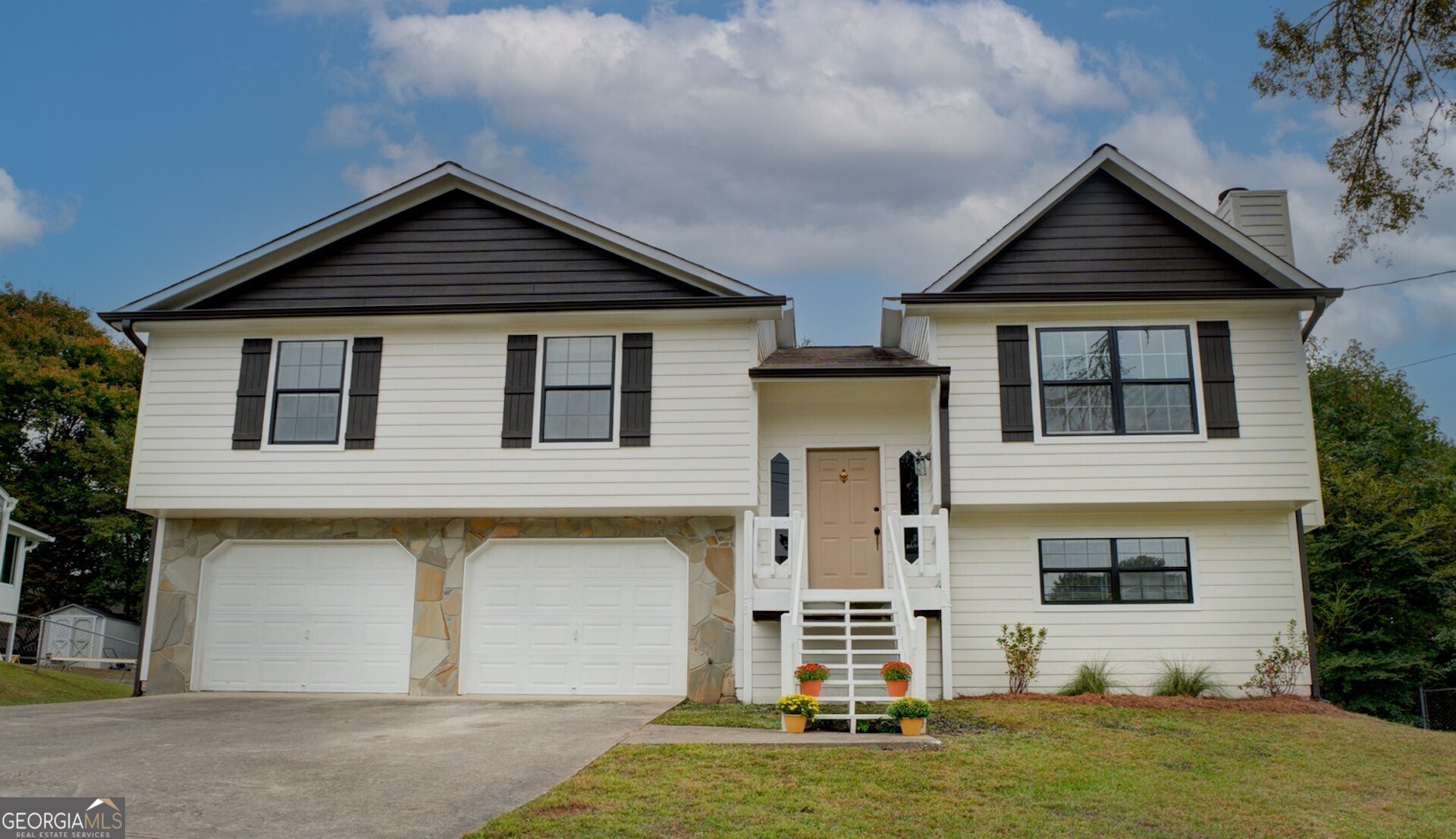 front view of a house with a yard