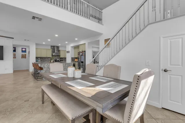 a bedroom with a bed couch and window