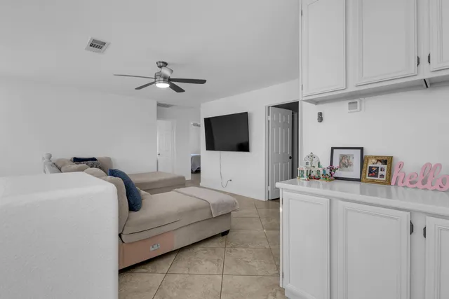 a spacious bedroom with a bed and a window