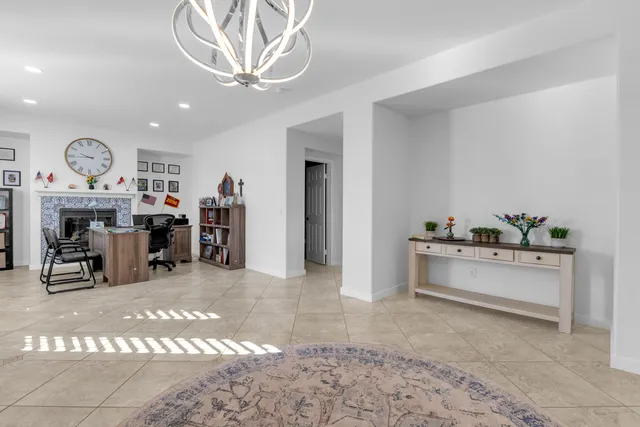 a large kitchen with kitchen island granite countertop lots of counter top space and stainless steel appliances