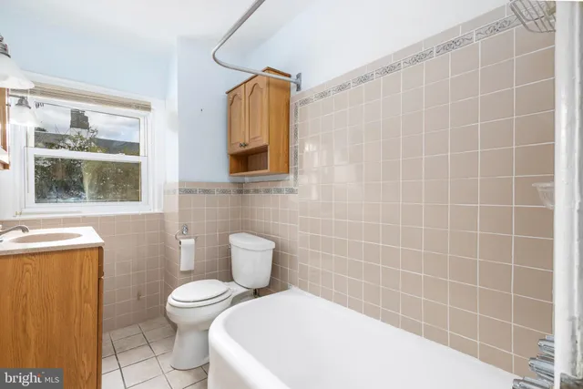 a bathroom with a toilet a sink and a shower