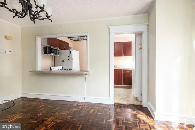 a view of a closet area with living room
