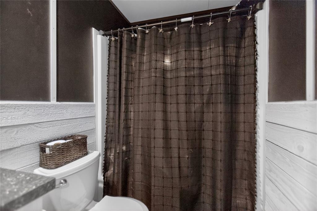 2857 Hickory Street Bunnell, FL 32110 - Photo 13 of 22 a bathroom with a toilet and shower