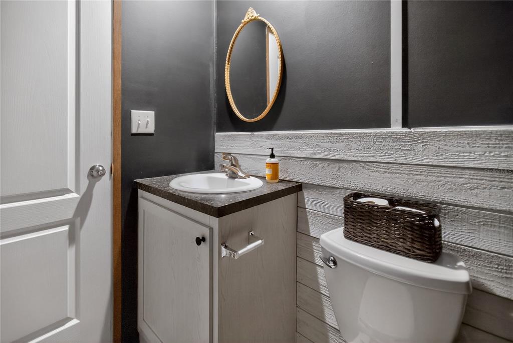 2857 Hickory Street Bunnell, FL 32110 - Photo 14 of 22 a bathroom with a sink and a mirror