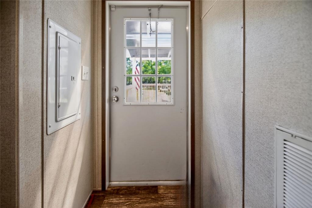 2857 Hickory Street Bunnell, FL 32110 - Photo 16 of 22 a view of front door with wooden floor