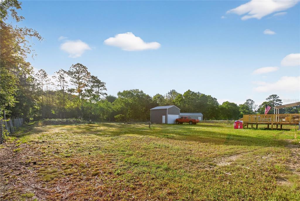 2857 Hickory Street Bunnell, FL 32110 - Photo 19 of 22 a view of a golf course with a lake