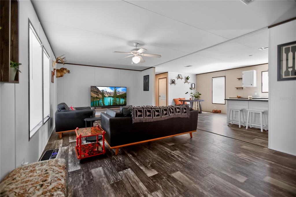2857 Hickory Street Bunnell, FL 32110 - Photo 2 of 22 a living room with furniture and a wooden floor