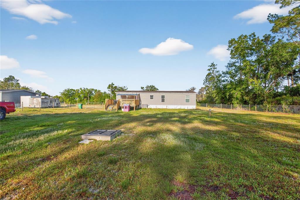 2857 Hickory Street Bunnell, FL 32110 - Photo 21 of 22 a view of a house with a yard