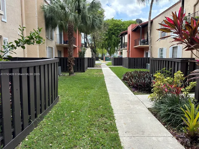 a view of a garden with pathway