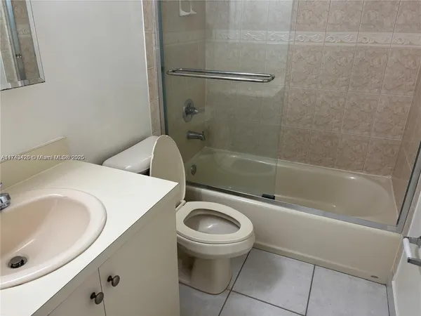 a bathroom with a sink a toilet and a bathtub