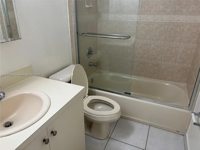 a bathroom with a sink a toilet and a bathtub
