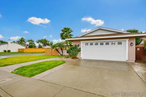a view of a swimming pool with outdoor seating