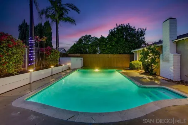 a view of a backyard with a patio