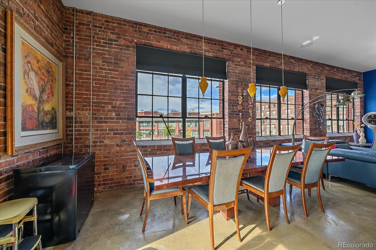 2500 Walnut Street, Unit 202 Denver, CO 80205 - Photo 15 of 31 a dining room with a table and chairs