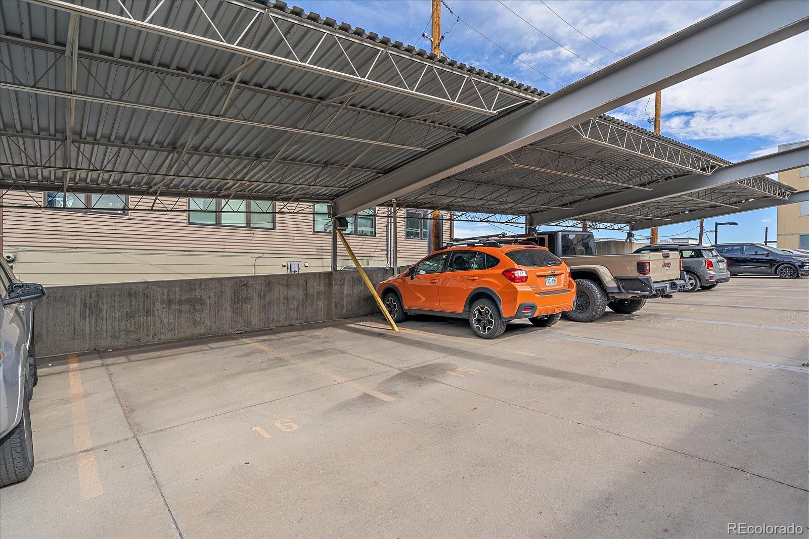 2500 Walnut Street, Unit 202 Denver, CO 80205 - Photo 28 of 31 a view of parking garage with cars parked