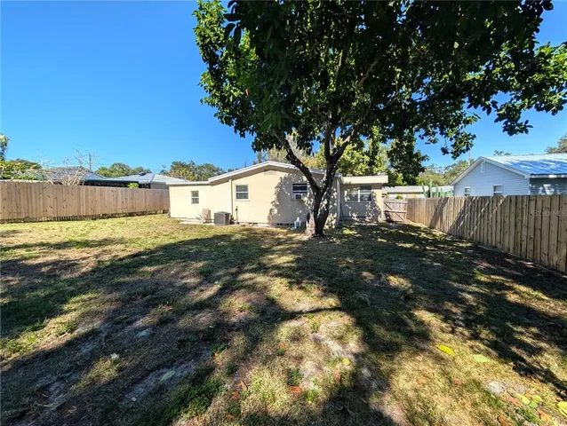 a view of swimming pool with a yard