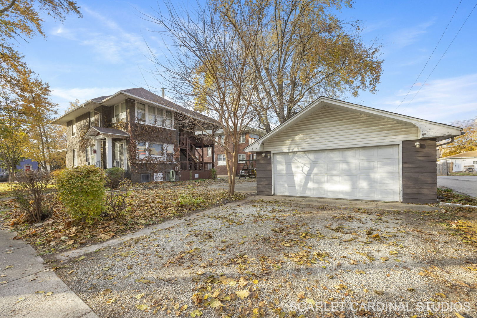 250 North Raynor Avenue Joliet, IL 60435 - Photo 1 of 17 a front view of a house with a yard and garage