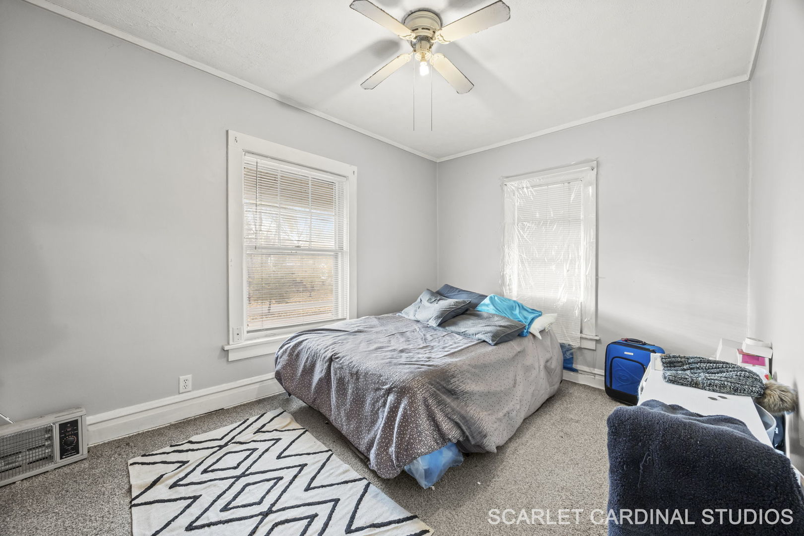 250 North Raynor Avenue Joliet, IL 60435 - Photo 12 of 17 a bedroom with a bed and a window