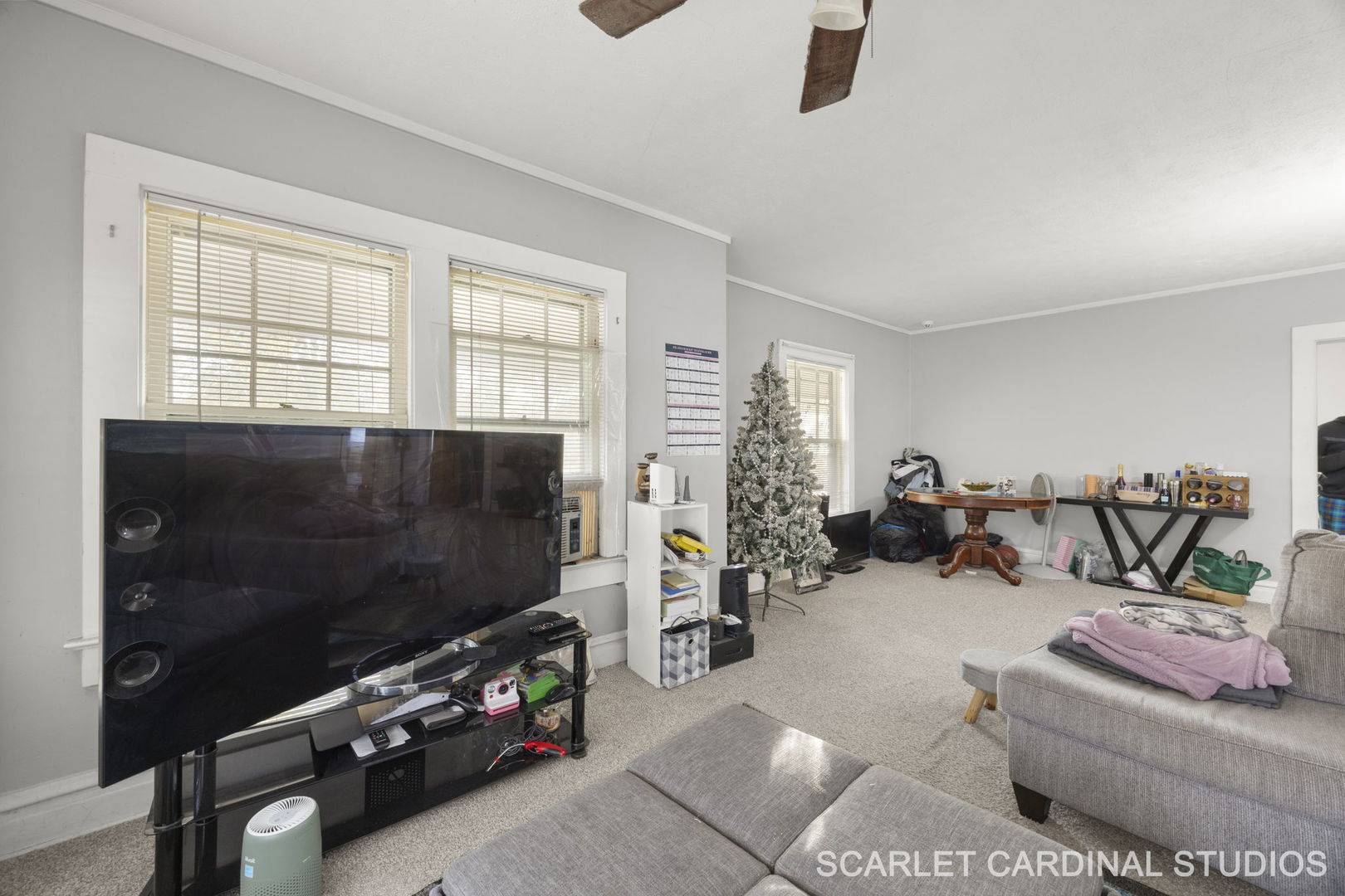250 North Raynor Avenue Joliet, IL 60435 - Photo 17 of 17 a living room with furniture a window and a flat screen tv