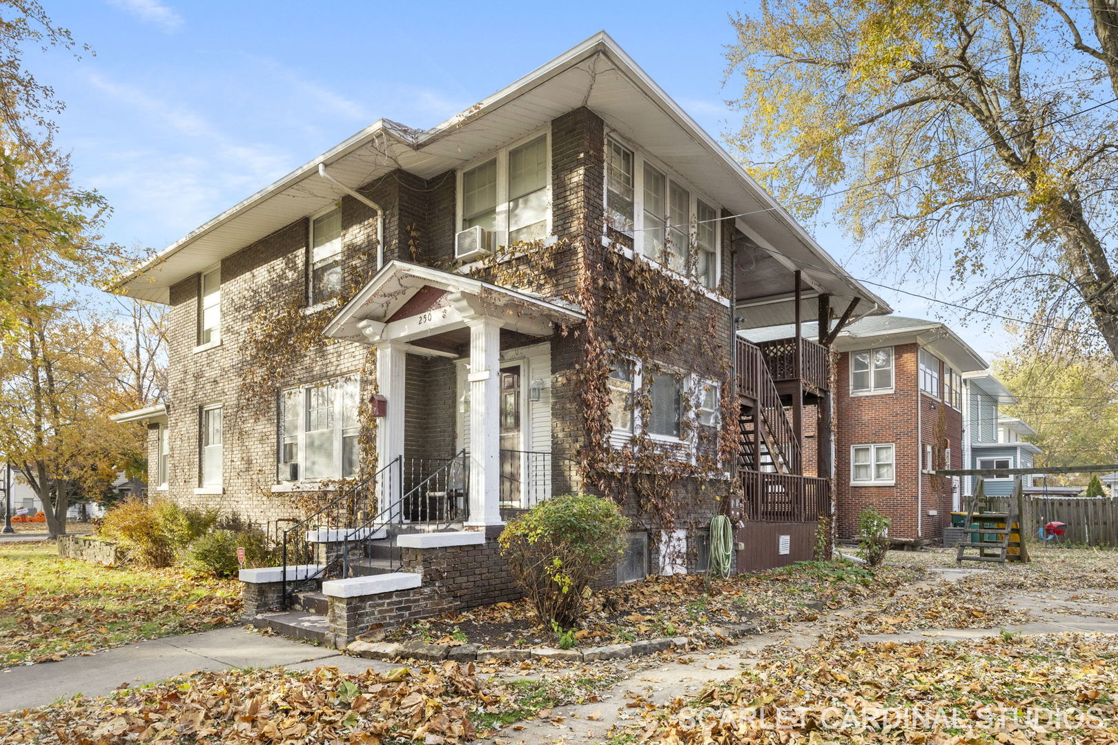 250 North Raynor Avenue Joliet, IL 60435 - Photo 2 of 17 a front view of a house with a yard