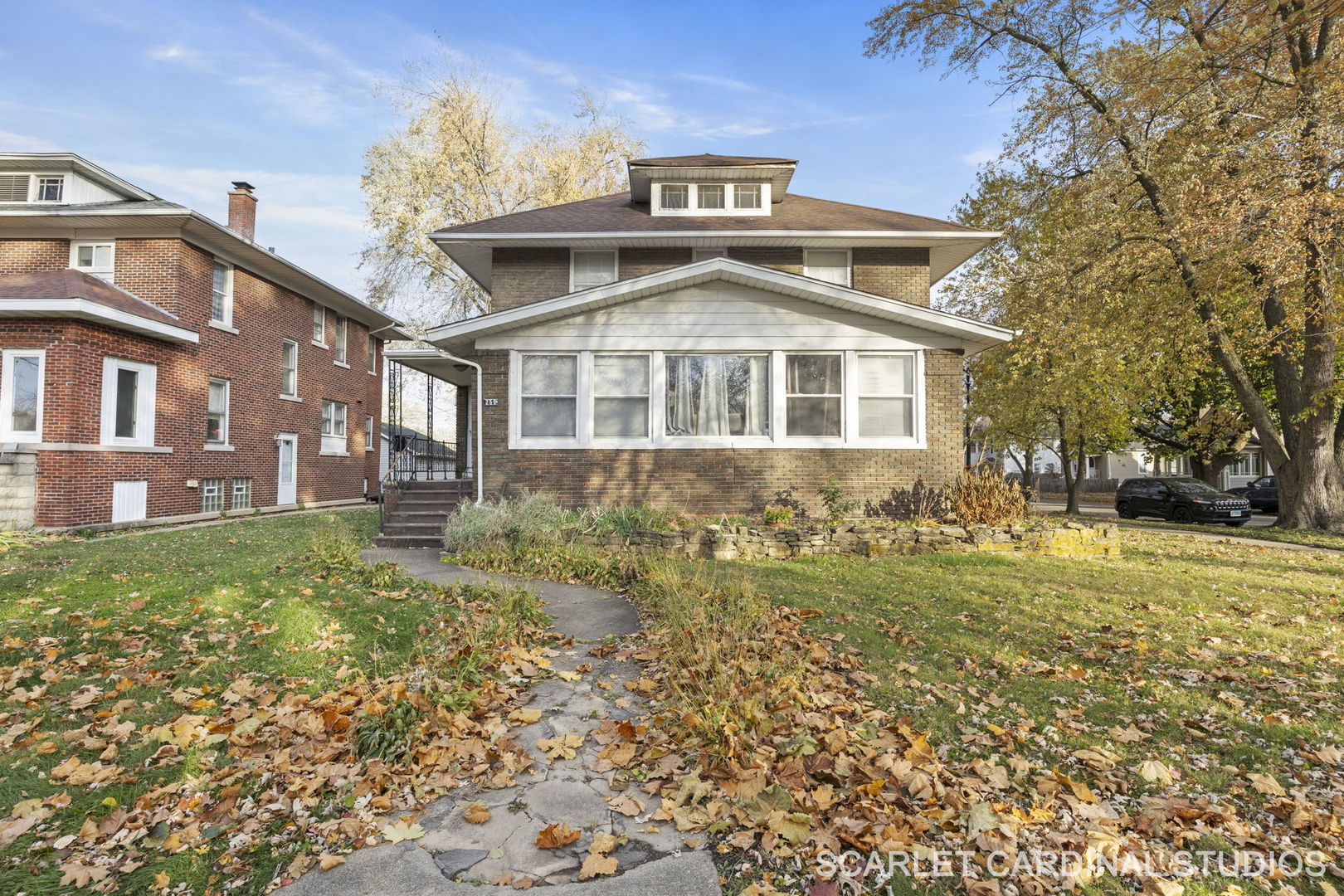 250 North Raynor Avenue Joliet, IL 60435 - Photo 3 of 17 a front view of a house with a yard