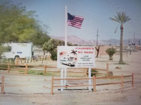 a view of a terrace with wooden fence