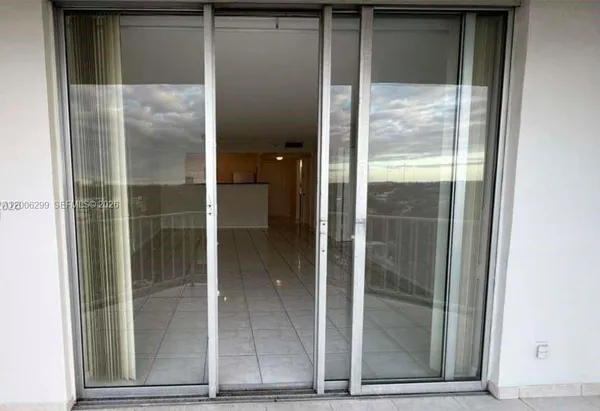 a bathroom with a glass door